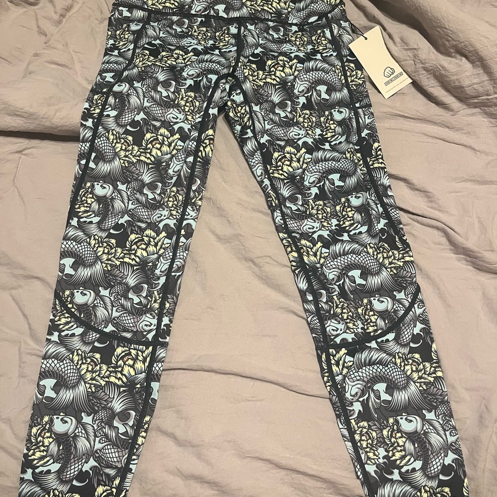 Brand new Feed Me Fight Me Don’t Be Koi full length leggings